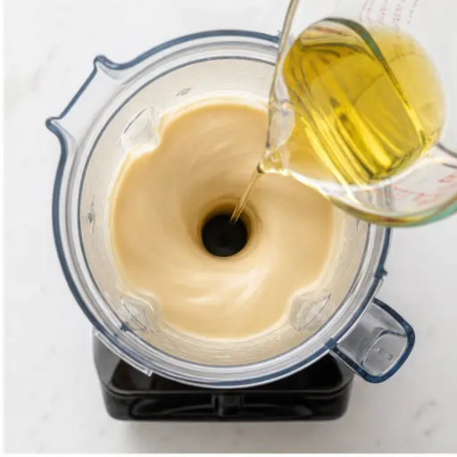 Step 2: Slowly adding oil for emulsification