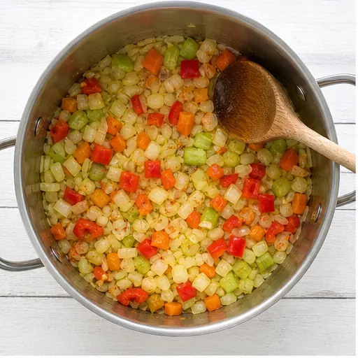 Step 1: Sweating onion, carrot, celery, and bell pepper until soft