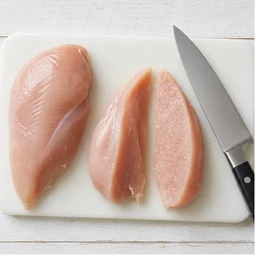 Step 1: Slicing chicken fillets in half lengthwise