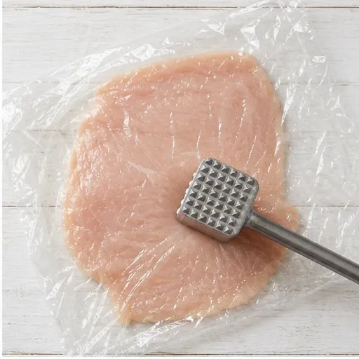 Step 2: Pounding chicken to even thickness