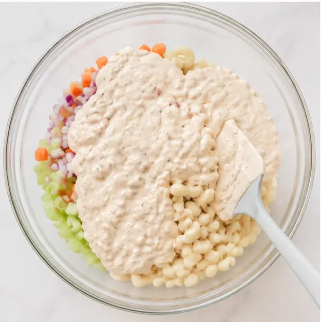 Step 3: Combining the dressing with the cooled pasta
