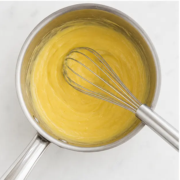 Step 3: Whisk over low heat until sauce thickens and becomes glossy