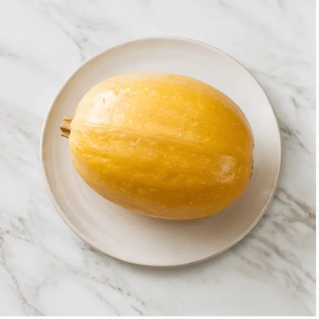 Step 1: Microwaving the whole spaghetti squash to soften the skin