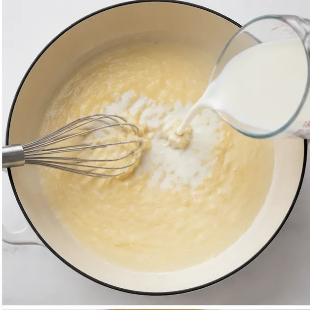 Step 2: Pouring hot milk into the roux