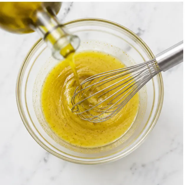Whisk lemon juice, Dijon mustard, agave, and olive oil into an emulsified dressing
