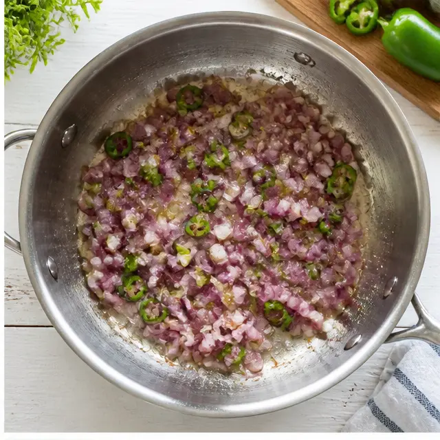 Sautéing red onion and jalapeño in the same skillet