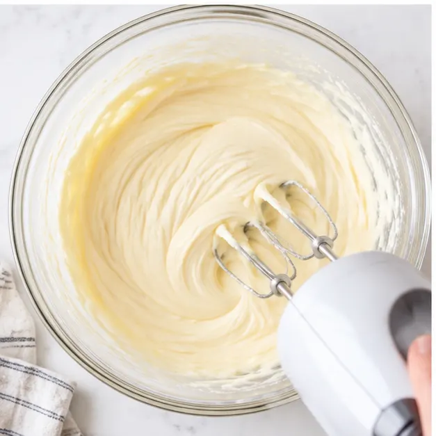 Beating silky cream cheese filling