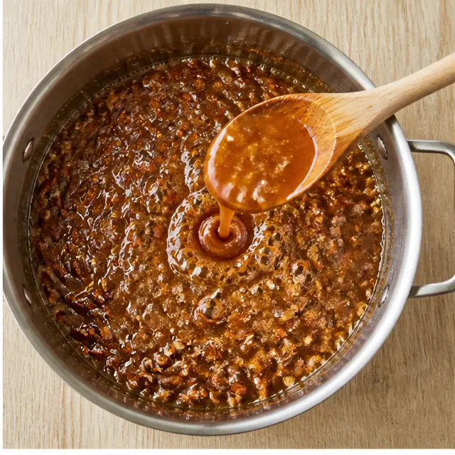 Step 2: Stir in pecan pieces and cook until the toffee deepens to amber at 295°F