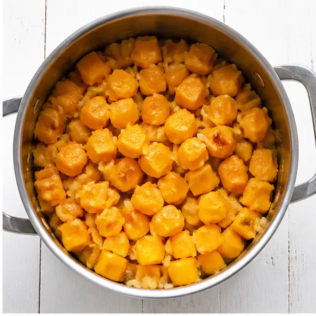 Add butternut squash cubes and cook until edges soften