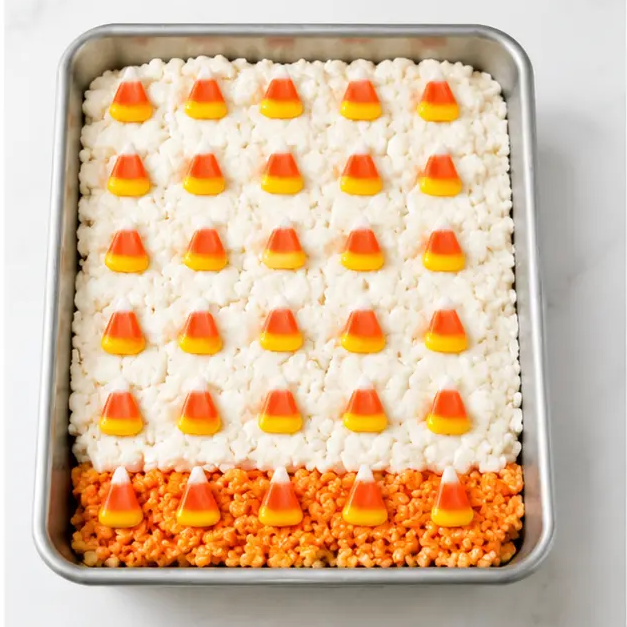 Step 4: Pressing candy corn pieces into the white top layer