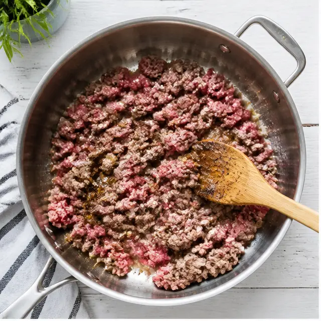 Step 1: Browning seasoned ground beef in a skillet