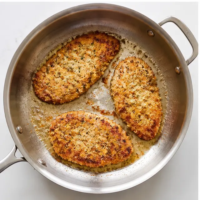 Step 3: Pan-frying breaded cutlets until golden brown in shimmering oil