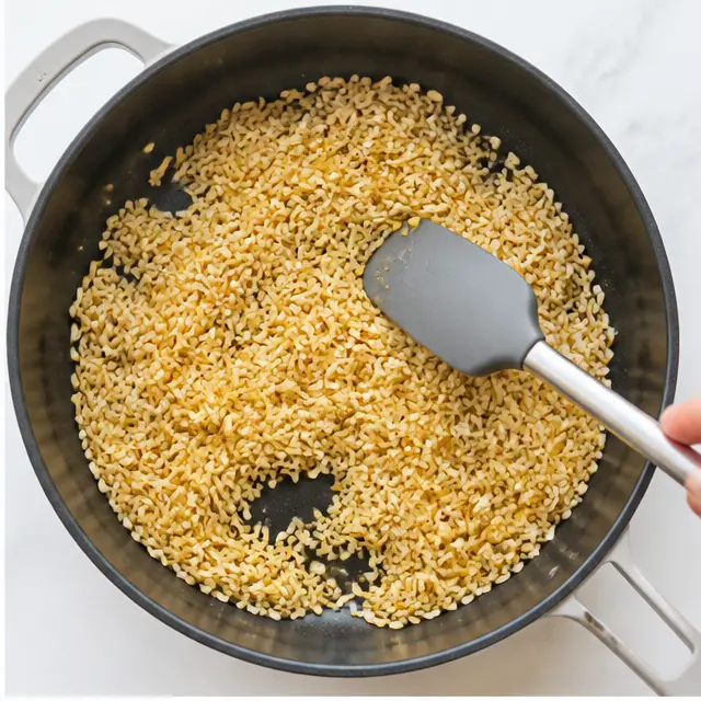 Step 2: Toasting jasmine rice in olive oil