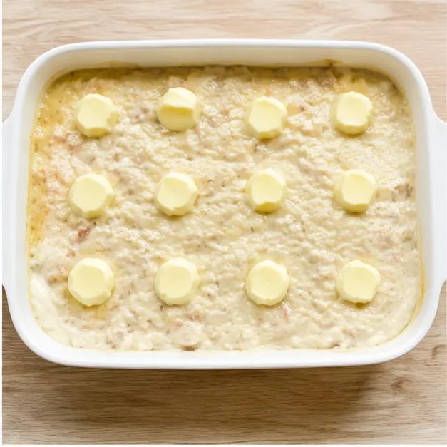 Step 2: Arranging butter pats evenly across the casserole top