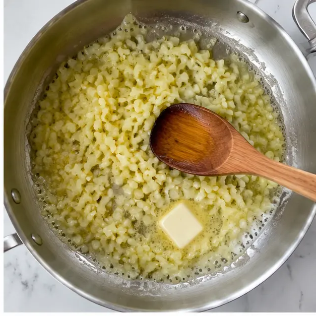 Step 2: Melting butter with onion and garlic for the sauce base