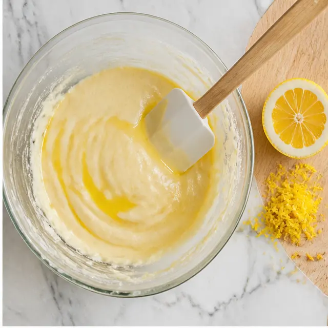 Step 2: Beating in egg, lemon juice, zest, and vanilla