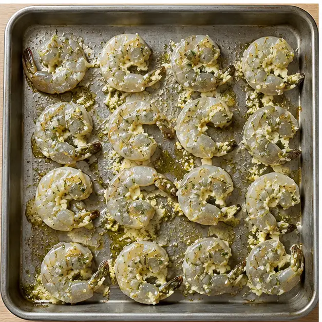 Step 3: Arranging coated shrimp in a single layer on a baking sheet