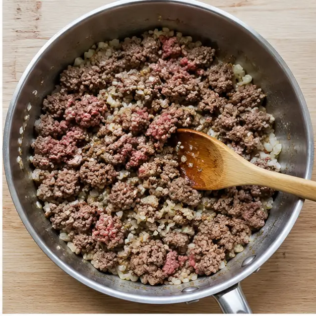 Brown the ground beef filling with onion and garlic
