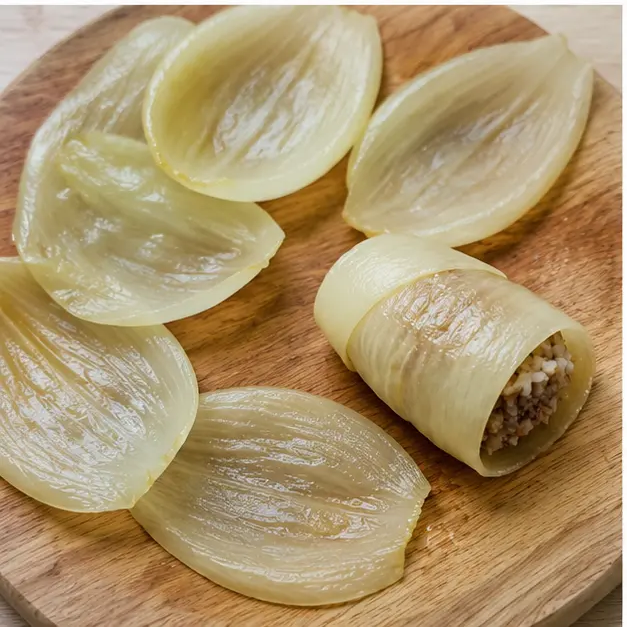 Roll the tender onion layers around the beef-and-rice filling