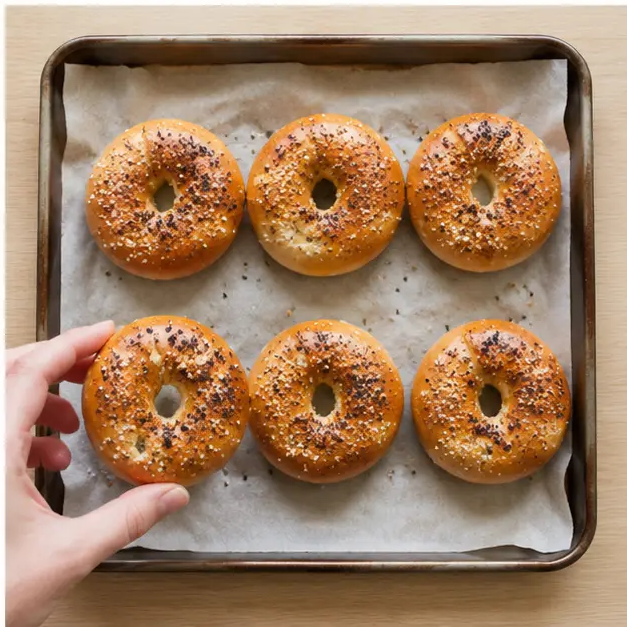 Baking egg-washed, topped bagel bites until golden brown