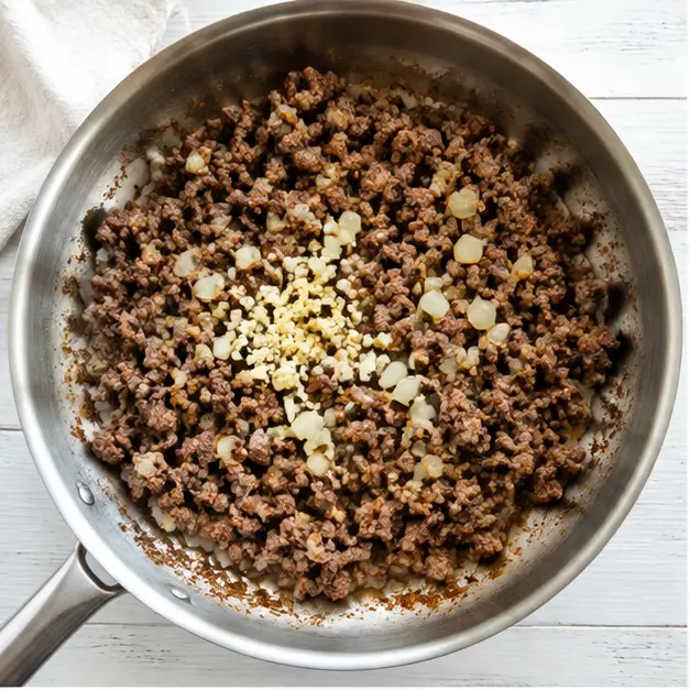 Step 1: Browning ground beef with onion and garlic