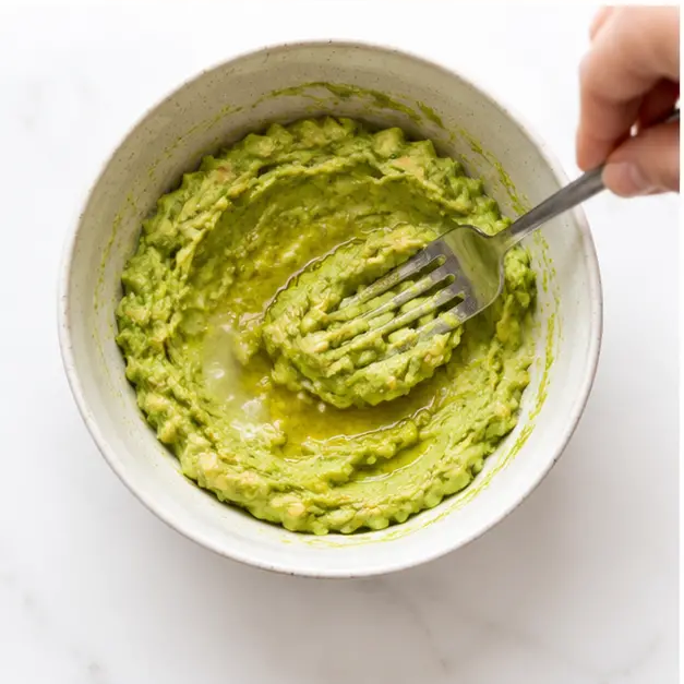 Spread the avocado mash onto the crispy hash browns