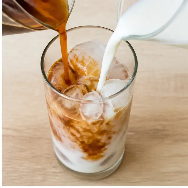 Step 2: Poured chai tea concentrate and milk over ice cubes