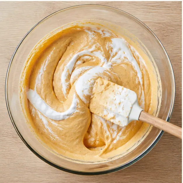 Folding whipped cream into the filling