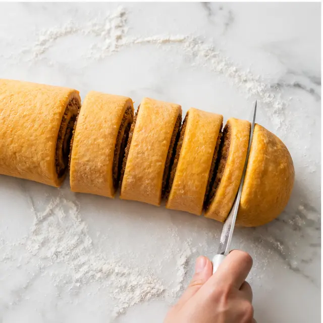 Step 3: Roll and cut the filled dough log