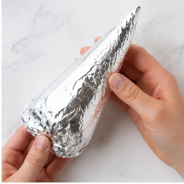 Step 2: Wrapping the cone tightly in foil