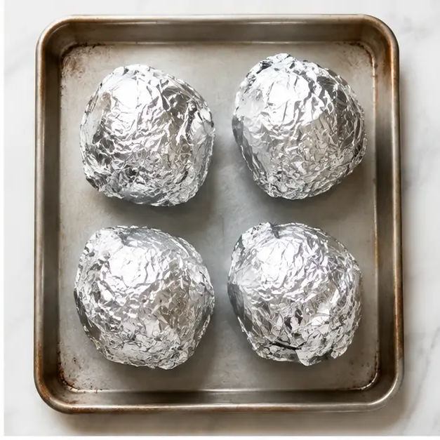 Step 2: Wrapping beets in foil packets for roasting