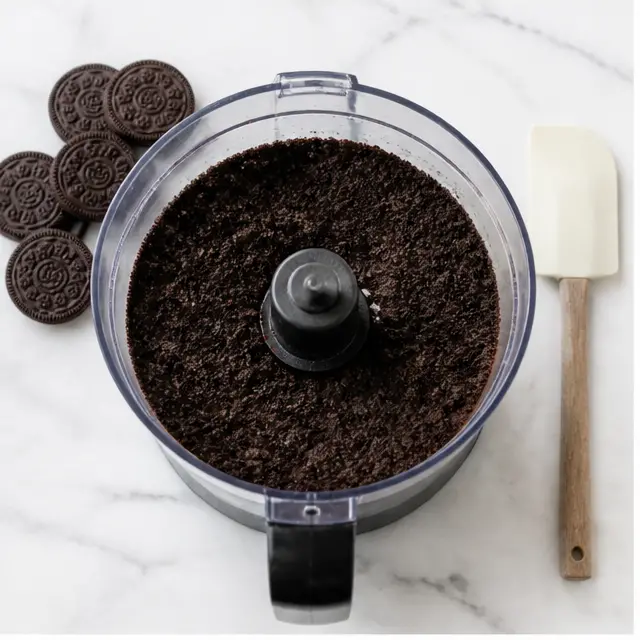Pulse cookies with melted vegan butter into fine wet-sand crumbs