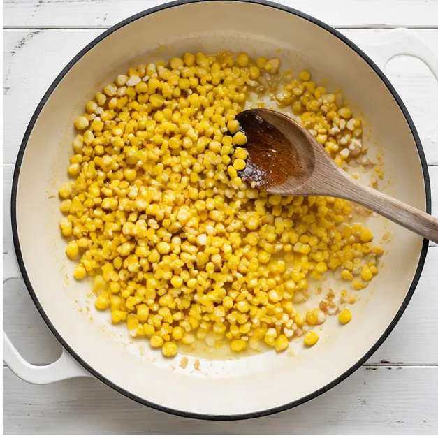 Step 2: Sautéing corn and garlic, extracting corn milk from cobs