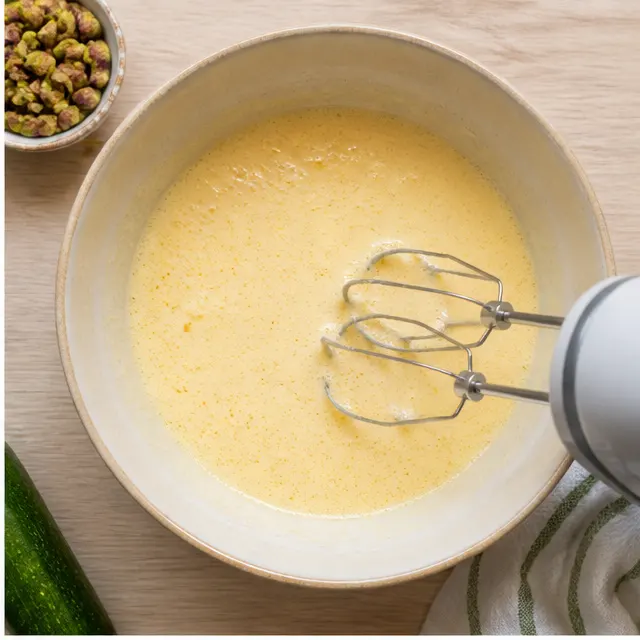 Beat eggs and sugar until pale and thick