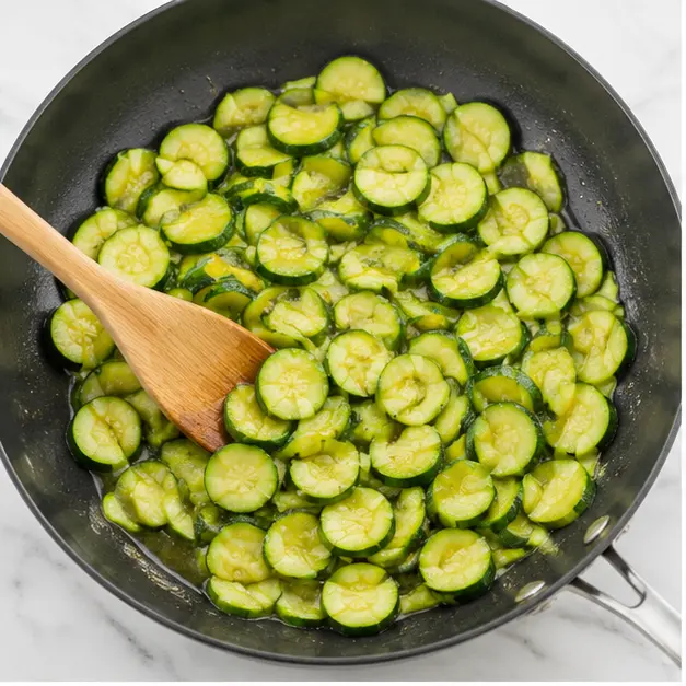 Step 1: Sauté sliced zucchini to soften and release water